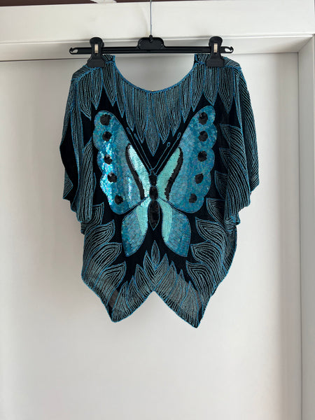 Blusa con farfalle e paillettes