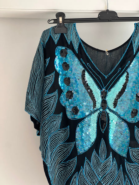 Blusa con farfalle e paillettes